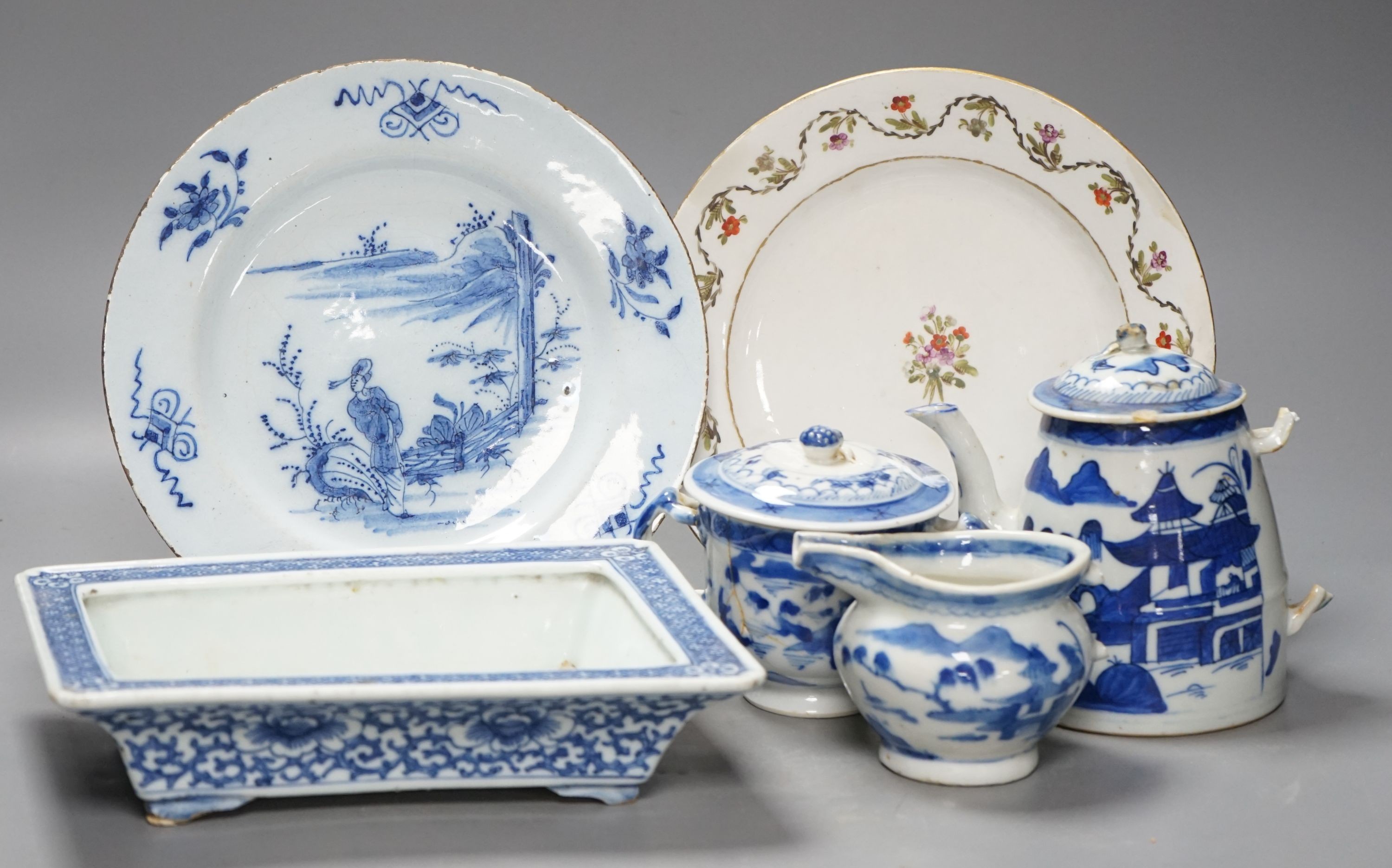 A Chinese blue and white bulb dish and a three piece teaset, a Delft plate and an English porcelain plate, 18th/19th century 23cm